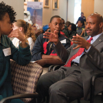 GUIDANCE SYSTEMS: Leland Melvin, former astronaut, now NASA associate administrator for education, sits amid schoolchildren. Programs that bring astronauts to schools across the country are pivotal to NASA’s outreach to young people. </br> Photo credit: Paul Alers/NASA