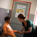 Physician Jennifer Furin tends to a patient in Nohana. </br>Photo credit: Justin Ide/Harvard News Service