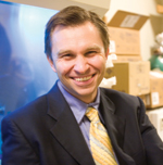 STRESS TESTERS: Researchers such as T. Keith Blackwell and David Sinclair (above) investigate how calorie restriction and other physiological pressures might prevent diseases that are associated with aging. In just about every creature in which calorie restriction has been tested—brewer’s yeast, bacteria, roundworms, and mice—it has lengthened the life span of the species, sometimes nearly doubling it.<br/>Photo by Kris Snibbe/Harvard University News Office
