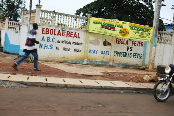Signs of the Ebola epidemic on the streets of Freetown, Sierra Leone, September 27. 2015. Image: Rebecca E. Rollins / Partners In Health
