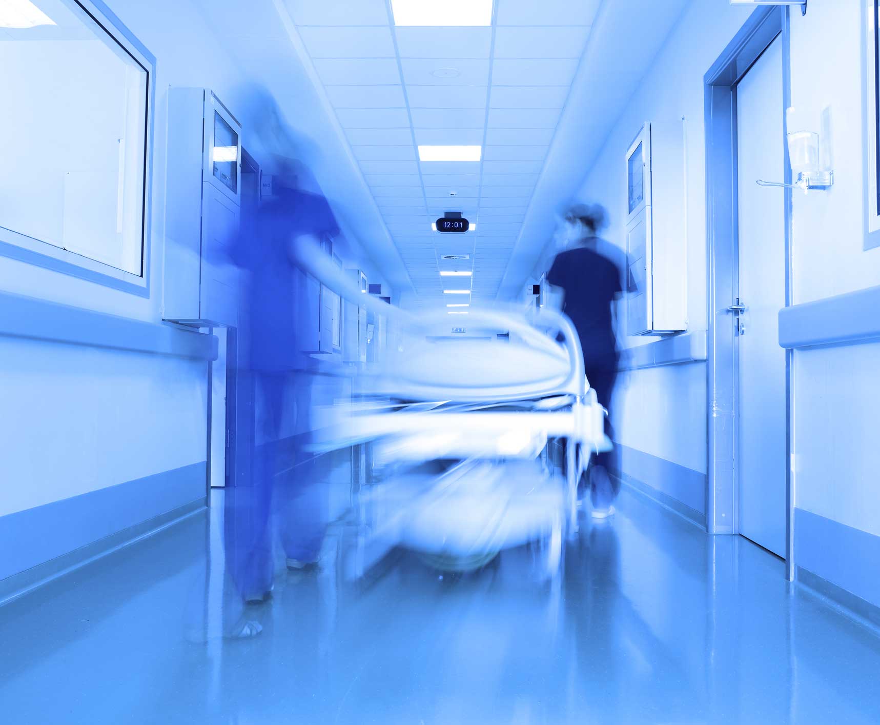 Blurry shot of gurney in a hospital hallway