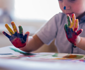 child with finger paints