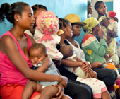 Mothers and children outside a primary health care center in Ranomafana, Madagascar.