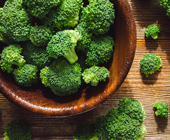 broccoli pieces in a wooden bowl