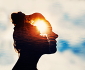 silhouette of person with sun