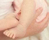 cropped photo of woman holding a baby