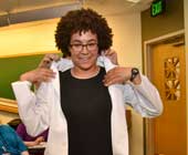 A student in the HMS Health Sciences and Technology program gets her white coat