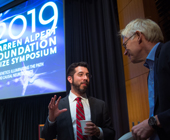 Photo of two speakers at symposium