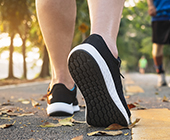 Photo of legs and feet of a person walking