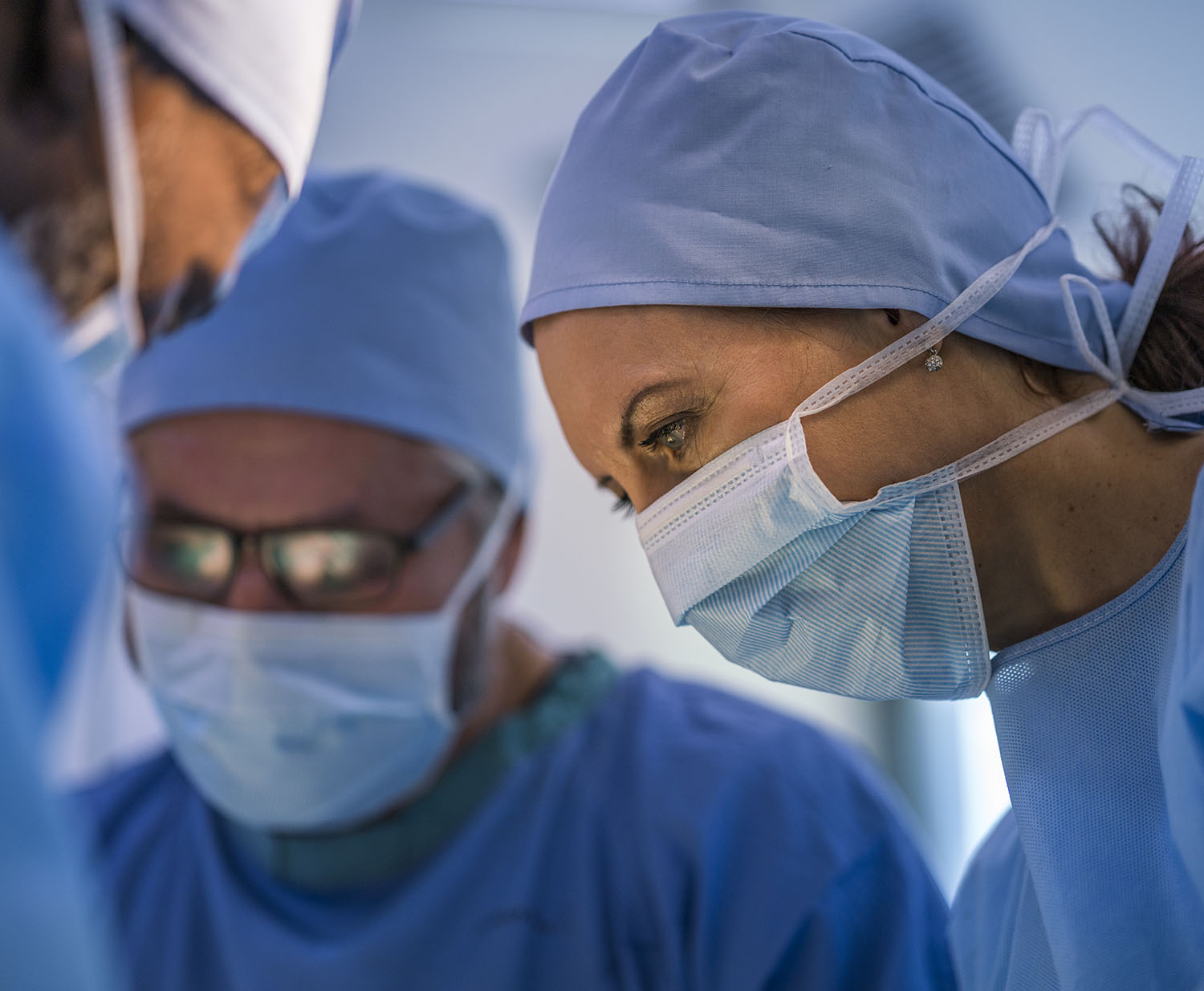 image of a male and female surgeons dressed in ppe