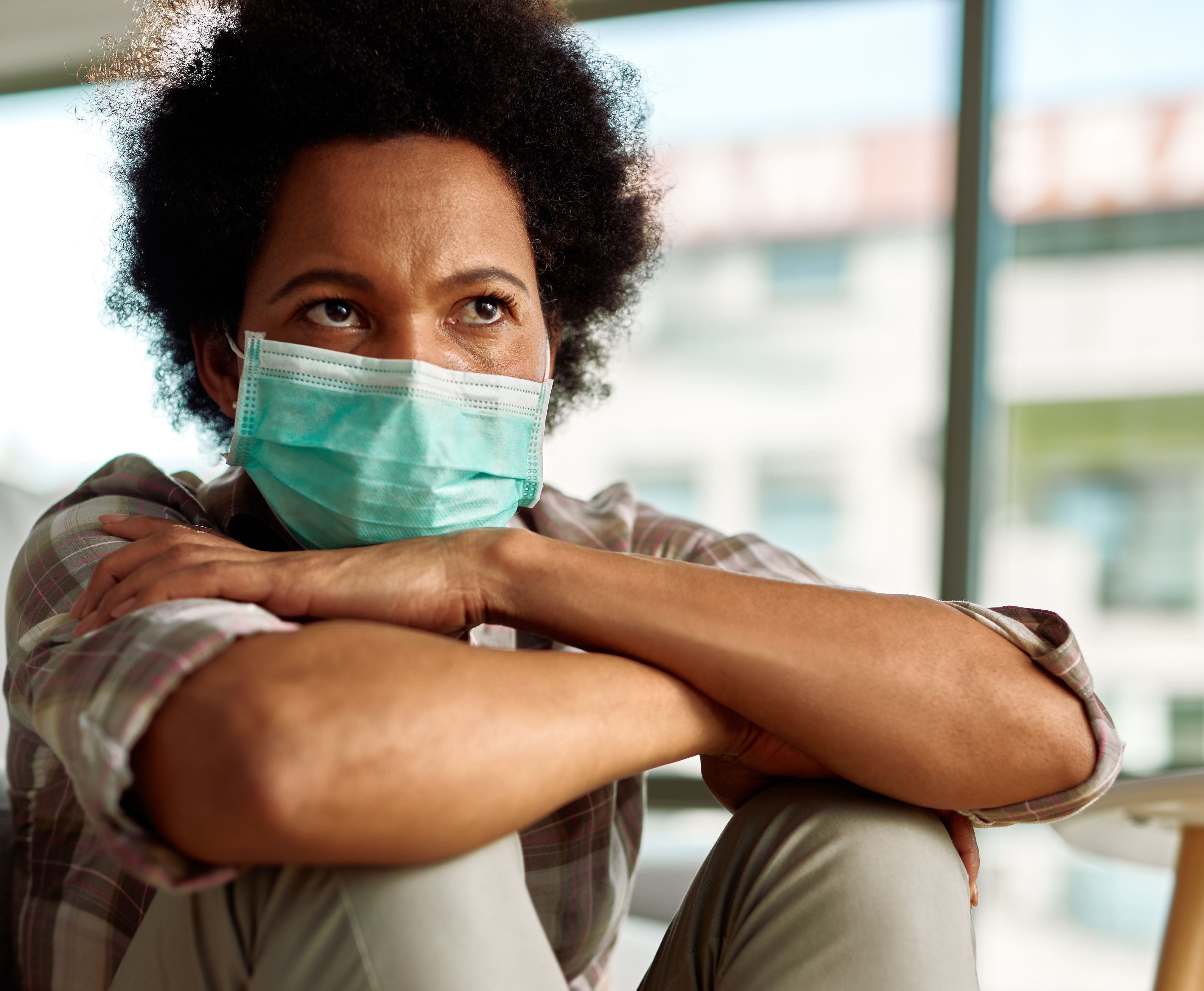 Photo of black women with medical mask on