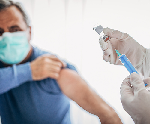 photo of person about to receive a vaccine