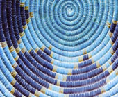 photo of inside of a woven basket with blue design