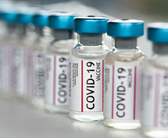 vials of vaccine that say COVID-19