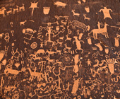 ancient cave art showing people and animals