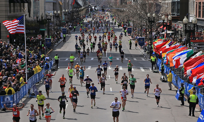view down Boylston Street of runners approaching finish line
