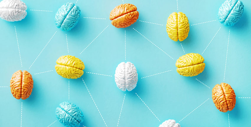 Many multicolored, stylized brains connected by dotted lines