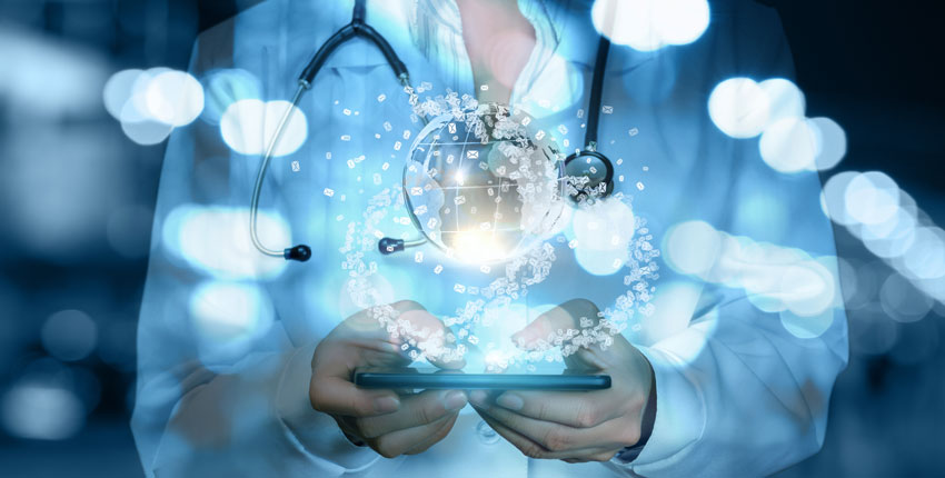 torso of a physician in a white coat and stethoscope draped around their neck holding a tablet with a clear globe floating above it