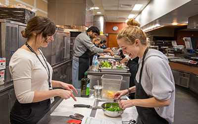 Eliza Leone (left) with student in a Teaching Kitchen class