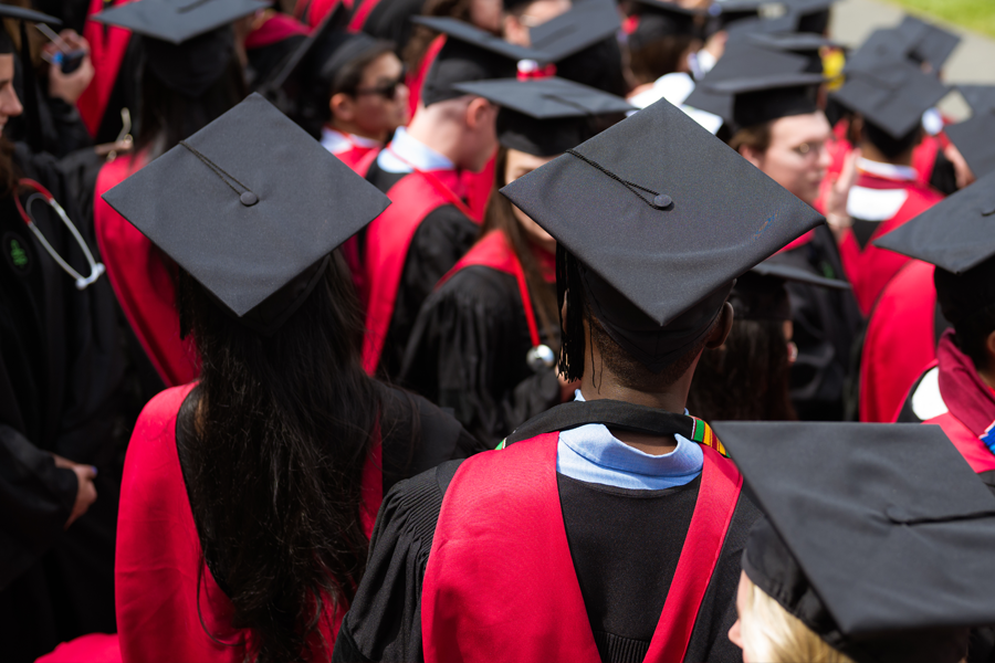 Group of graduating students in cap and gown regalia