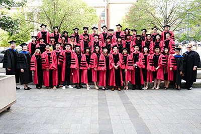 Graduates and leaders in the Biological and Biomedical Sciences (BBS) program gathering to take a group photo.