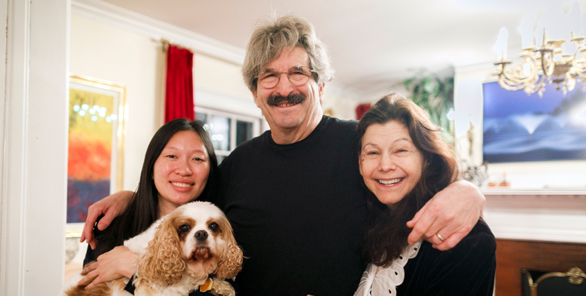 Gary Ruvkun with daughter Victoria Ruvkun (left), dog Barnaby, and wife Natasha Staller the morning of the announcement at their home in Newton.