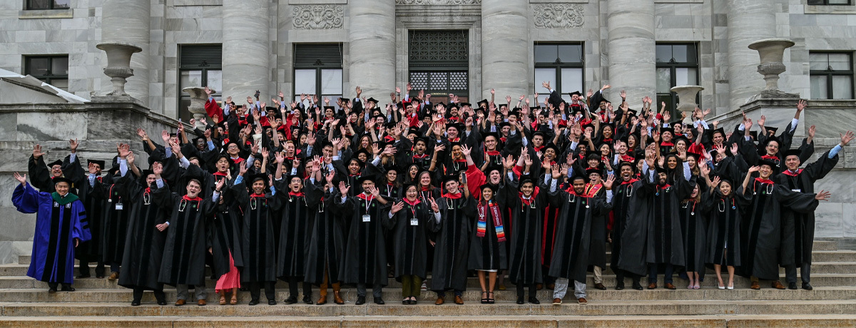 The entire medical and dental school class on the steps of a marble building.