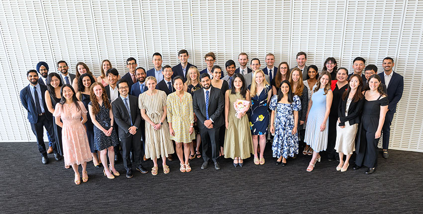 Group photo of HST graduates smiling