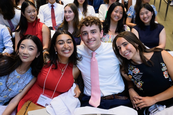 Students lean in together for a candid shot.