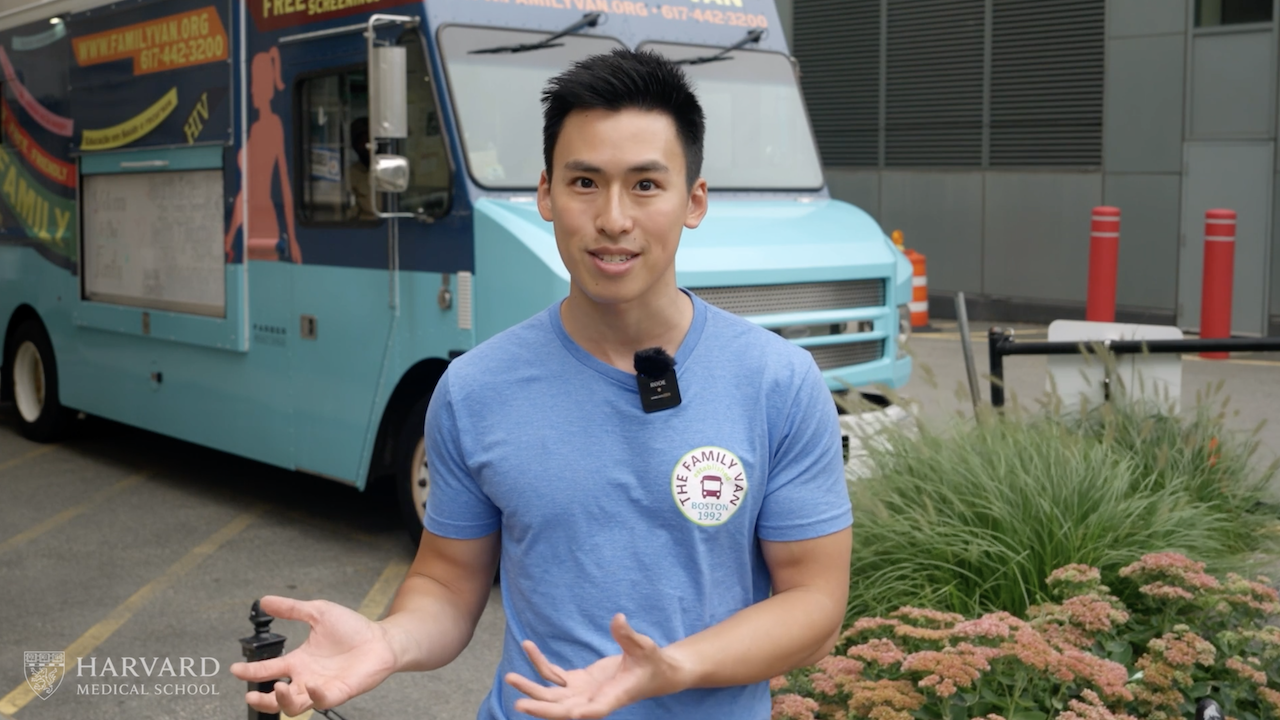 MD-MPP candidate Jonathan Wang speaks in front of the Family Van.