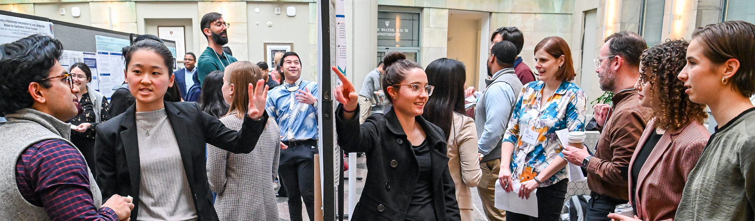 Students present research to peers and faculty on Soma Weiss Days as they gather at their academic posters.
