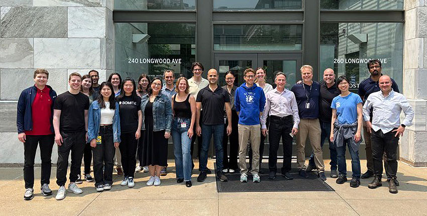 Team of people standing in front of a building