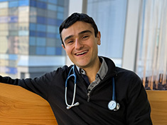 A man with a stethoscope draped around his neck