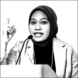 Black and white headshot photo of a young woman in a hijab gesturing with her index finger raised