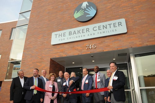 ribbon cutting ceremony in front of building
