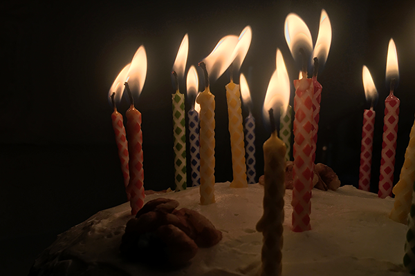 lit candles on a cake