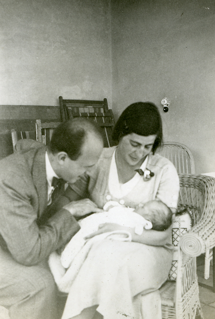 Schur as an infant, held by his mother and looked upon by his father