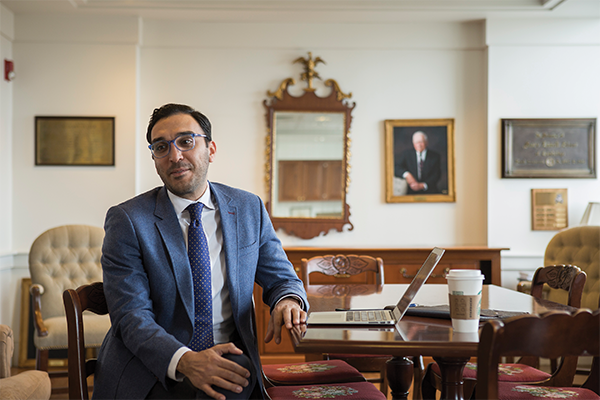 Edwin Raffi seated in his office at a table