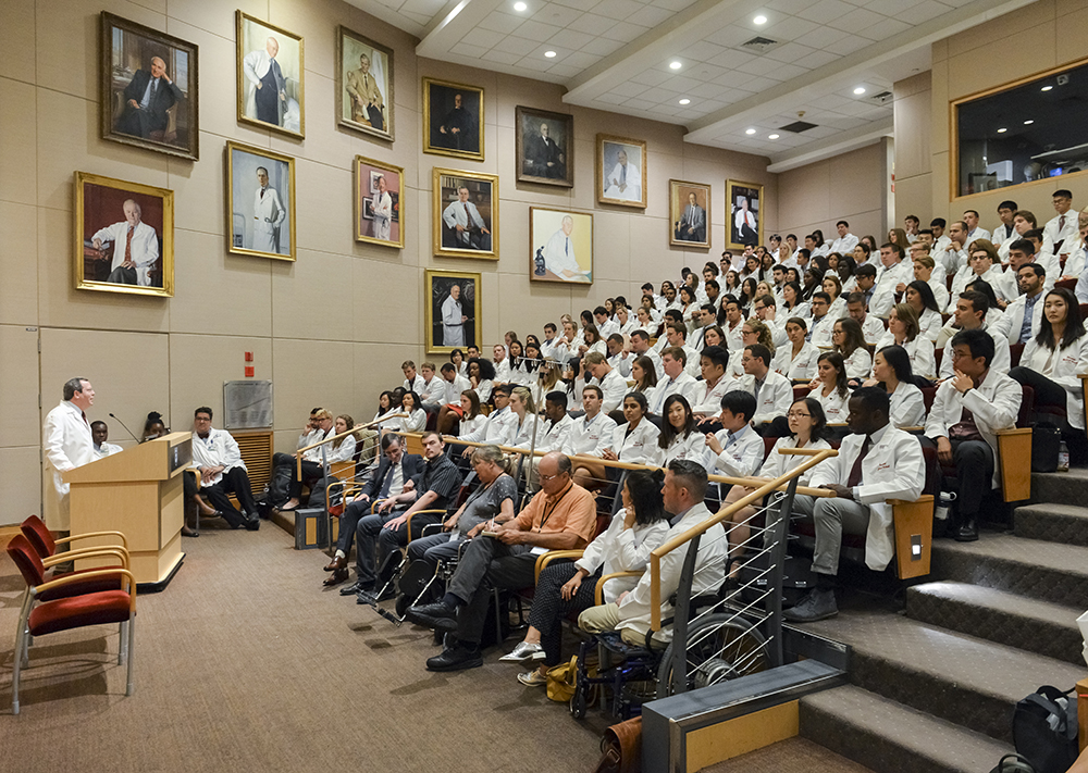 Dean Ed Hundert speaks to the HMS/HSDM class of 2021 at their first patient clinic.