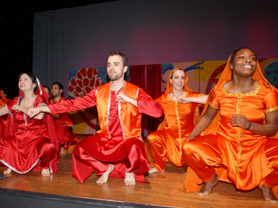 A group of Dean Dienstag’s red blood cells perform a bhangra dance for the faculty visitors. Photo by Steve Gilbert.