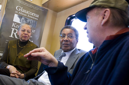 Nancy Oriol, HMS dean for students, and Alvin Poussaint, HMS faculty associate dean for student affairs, talk with client Pette Roger (right) on board the Family Van, a mobile health clinic that travels to lower-income neighborhoods in Boston in an effort to expand access to healthcare, offering medical screenings, health education and referrals to other resources, including physicians. Oriol and Poussaint visited the Family Van during National Volunteer week, April 19 to 25. Photo by Stephanie Mitchell/Harvard News Office.