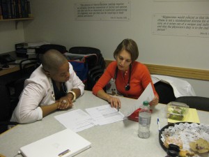 HMS students in the Crimson Care Collaborative, including Mekeme Utuk (left) and Erika Pabo, are developing a model to expand access to primary care. Photo by Julia Carnevale.