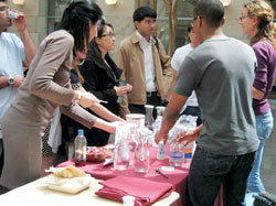 SEAM coleaders Devan Darby and Julian Thomas, along with HMS first-years Allen Ho, Roshan Sethi, Rena Xu, Darja Djordjevic and Omar Pardesi, conducted a tap water taste test at the Sustainability Fair in the Courtyard Café during this year’s Earth Week celebration. Photo by Allen Hebert.