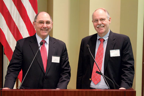 A recent session of the Harvard Catalyst course Introduction to Clinical Investigation, led by Elliott Antman (left) and James Ware, focused on a hypothetical new compound—a white powder—to take participants through the steps of clinical testing on the way to a successful new drug. Photo by Kerry Foley/CBMI