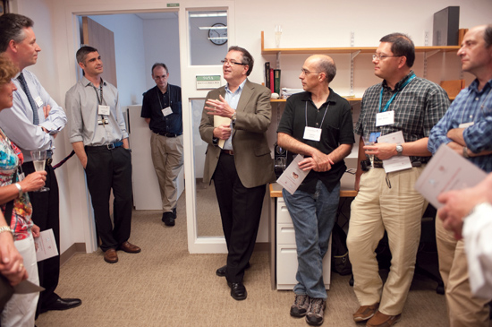 At the opening are members of the HMS neuroscience community (from left) Cynthia Lemere, associate professor of neurology at Brigham and Women’s Hospital; Adrian Ivinson, director of the NeuroDiscovery Center; Dodart; Greg Cuny, assistant professor of neurology at BWH; Dean Flier; Gabriel Corfas, professor of neurology at Children’s Hospital Boston; Takao Hensch, professor of neurology at Children’s; and Michael Greenberg, head of the HMS Department of Neurobiology. Photo by Suzanne Camarata.