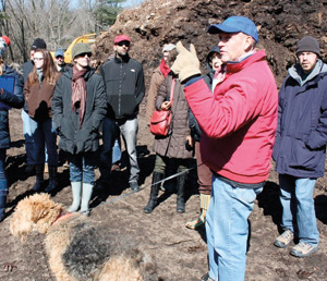 At Brick Ends Farm, Harvard students get a tour of the compost fields from Peter Britton, who founded the farm in 1975 to improve local farmland and divert food waste from landfills. Photo by Angela Alberti.