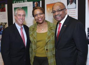 From left: Andrew Warshaw, chief of surgery at Mass General Hospital, Joan Reede, HMS dean for diversity and community partnership, and visiting surgeon L.D. Britt celebrated the opening of two exhibits at Countway Library Dec. 9. Photo by Jeff Theibauth.