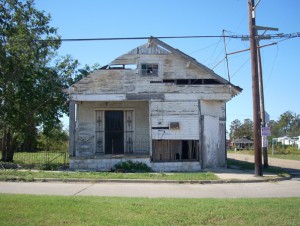 The presence in a neighborhood of houses in a state of disrepair, like this Lower 9th Ward home, still battered and broken nearly four years after Hurricane Katrina, may limit access to high-quality medical care. Photo courtesy Jaya Aysola.