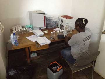 Testing water samples in Haiti for bacterial contamination. Photo by Wilfredo Matias