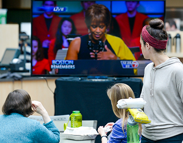 At HMS, community members gathered over the lunch hour to watch the marathon tribute. Image: Steve Lipofsky